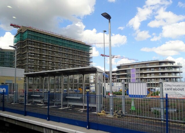 Reading Green Park Station under construction. When completed it will serve the Green Park business area, Madejski Stadium and the Green Park Village residential development seen under construction in the background of the shot.